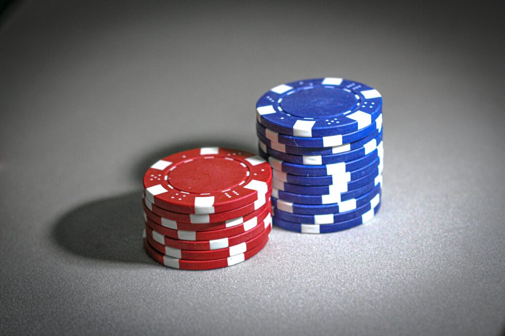poker chips on a gray surface