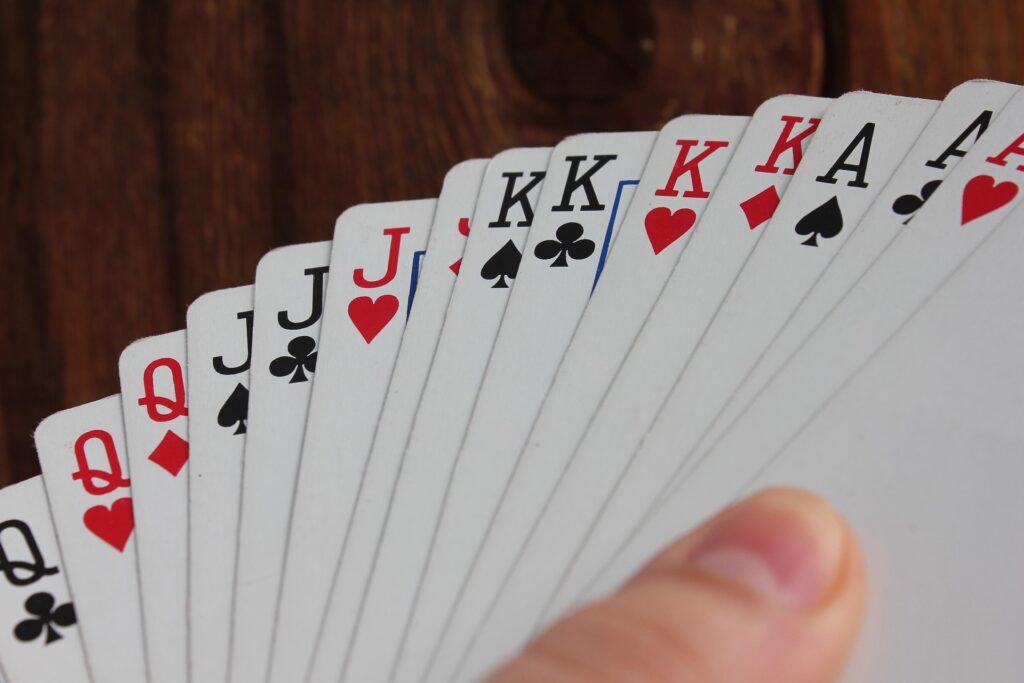 playing cards held in a spread