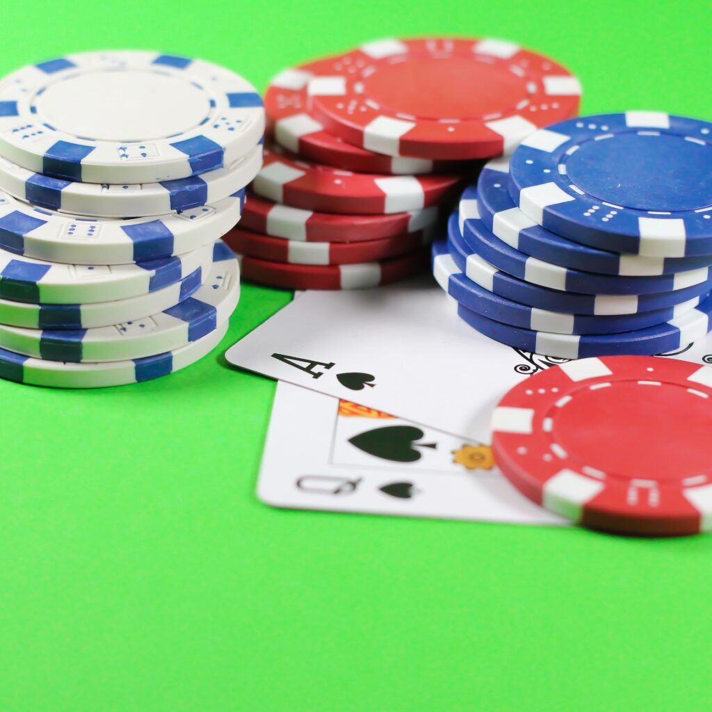 A blackjack with chips stacked on top