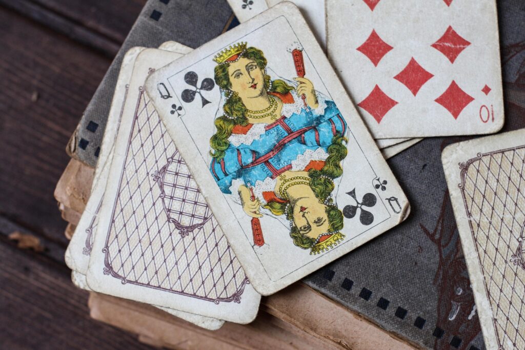 vintage playing cards on a wooden table