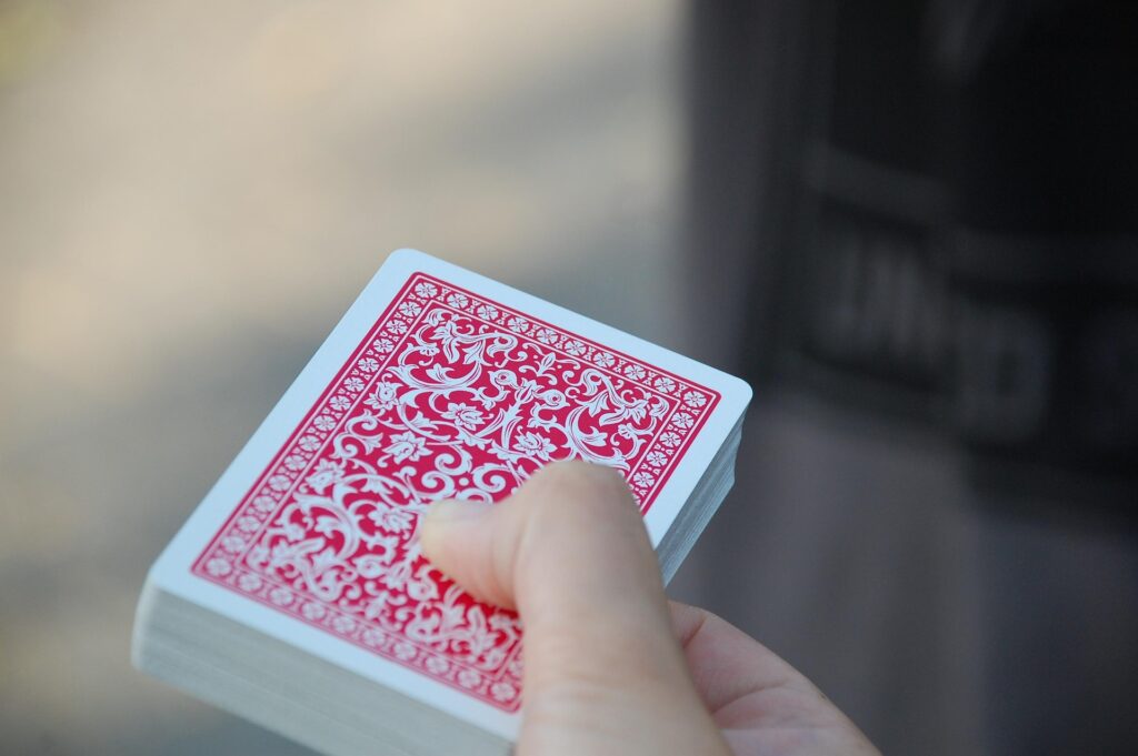 Somebody holding a deck of cards